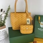 Goyard Bags 165 Goyard Bag is leather version of iconic Saint Louis bag, with Goyardine canvas lining.It offers two different aesthetic styles.Its gradually thickened handle provides a good grip comfortable feel.The compact and small form factor makes Anjou Mini perfect for nighttime use or carrying some daily essentials during the day. Style number: 98196 Color: Yellow Size: 9cm x 19.5cm