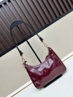 Prada Bags Batch 310 Lacquered Cowhide with Box Re－Edition NaplaK Prada Women's Shoulder or Crossbody Bag Size 22.5X18.5X7CM A bag that recreates the style grids 2005.Prada's design codes are condensed into versatile silhouettes, creating a dialogue between past present styles.Adjustable shoulder strap, parts, detachable key ring, exquisite simple leather item.The triangular logo of enamel metal exudes an iconic and charming design. - Image 3