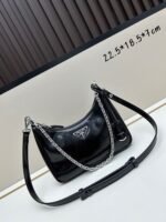 Prada Bags Batch 310 Lacquered Cowhide with Box Re－Edition NaplaK Prada Women's Shoulder or Crossbody Bag Size 22.5X18.5X7CM A bag that recreates the style grids 2005.Prada's design codes are condensed into versatile silhouettes, creating a dialogue between past present styles.Adjustable shoulder strap, parts, detachable key ring, exquisite simple leather item.The triangular logo of enamel metal exudes an iconic and charming design.