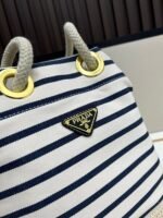 Prada Bags Batch 230 Prada New Products Let's Check Out This Season's Super Eye-catching Bags Canvas Striped Mariner Bucket Handbag, Red and White Stripes Woven Handle ~ Large capacity, ultra-lightweight, especially suitable for commuting! color scheme also suits vacation well⛱ The bag design is very thoughtful with metal rings on both sides, allowing you to hang your favorite doll pendants freely ​ Dimensions 26x28x12, model 2548 - Image 4