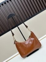 Prada Bags Batch 310 Lacquered Cowhide with Box Re－Edition NaplaK Prada Women's Shoulder or Crossbody Bag Size 22.5X18.5X7CM A bag that recreates the style grids 2005.Prada's design codes are condensed into versatile silhouettes, creating a dialogue between past present styles.Adjustable shoulder strap, parts, detachable key ring, exquisite simple leather item.The triangular logo of enamel metal exudes an iconic and charming design. - Image 3