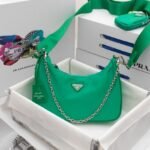 Prada Bags 185 Return Top Original Prada New Nylon Handbag/Underarm Bag trendy bag from internet-famous sister group now available in new style! This Hobo bag's design fantastic three uses: waist bag/crossbody/single The handle been replaced chain, adding touch of sexiness underarm bag. comes long strap. What I love most is the shoulder strap has a small pendant pouch that can also be hung on other bags or pants as an accessory. It goes well with various outfits. Hurry up and get it, it's so beautiful! Model: pD001, Dimensions: Length 22X Height 18x Bottom 6.5cm