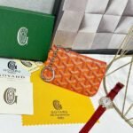 Goyard Bags 70 Goya Sénat Nano Key Case features an internal D-ring zipper closure system secure key storage.Its size is very practical and ideal for storing cards, small change, or badges. Style number: 98991 Color: Orange Size: 13cm 1cm x 9cm