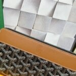 Goyard Bags 90 Goya Matignon Large Wallet is designed as long style with full closure security.It contains 12 card slots, a central zipper pocket, two large storage compartments for cards, banknotes, coins, and other daily documents. Style number: 98188 Color: Black/Brown Size: 20cm 2.3cm x 11cm - Image 3