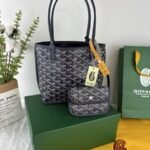 Goyard Bags 165 Goyard Bag is leather version of iconic Saint Louis bag, with Goyardine canvas lining.It offers two different aesthetic styles.Its gradually thickened handle provides a good grip comfortable feel.The compact and small form factor makes Anjou Mini perfect for nighttime use or carrying some daily essentials during the day. Style number: 98196 Color: Dark Blue Size: 9cm x 19.5cm