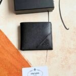 Prada Bags 75PRADA Men's Short Wallet Counter Latest Style, Official Website Synchronization, Genuine Development, Model 2M0513 # Color as shown, blue. The blue leather texture is excellent, with threaded lining. Imported white steel hardware accessories feature a complex color-blocking design, making it more fashionable and unique. Dimensions: Length 11cm, Height 9cm