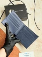 Prada Bags 75PRADA Men's Short Wallet Counter Latest Style, Official Website Synchronization, Genuine Development, Model 2M0513 # Color as shown, blue. The blue leather texture is excellent, with threaded lining. Imported white steel hardware accessories feature a complex color-blocking design, making it more fashionable and unique. Dimensions: Length 11cm, Height 9cm - Image 4