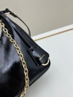 Prada Bags Batch 310 Lacquered Cowhide with Box Re－Edition NaplaK Prada Women's Shoulder or Crossbody Bag Size 22.5X18.5X7CM A bag that recreates the style grids 2005. Prada's design codes are condensed into versatile silhouettes, creating a dialogue between past present styles. Adjustable shoulder strap, parts, detachable key ring, exquisite simple leather item. The triangular logo of enamel metal exudes an iconic and charming design. - Image 6