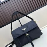 Prada Bags Comes with box, batch 250, life-saving. Totally captivated by this Prada nylon reporter Classic Triangle Logo➕ gold Hardware✨ Who knows! gives off such a high-end vibe Nylon material waterproof durable. This college student no longer afraid of their bag getting soaked in the rain! Multi-pocket design hold textbooks, cosmetics, small items... everything can be organized clearly✅ There are also two detachable shoulder straps, elegant hand-carrying and casual for crossbody use, switching between them is super smooth ​Large size 28x22x11, model 2566