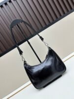 Prada Bags Batch 310 Lacquered Cowhide with Box Re－Edition NaplaK Prada Women's Shoulder or Crossbody Bag Size 22.5X18.5X7CM A bag that recreates the style grids 2005.Prada's design codes are condensed into versatile silhouettes, creating a dialogue between past present styles.Adjustable shoulder strap, parts, detachable key ring, exquisite simple leather item.The triangular logo of enamel metal exudes an iconic and charming design. - Image 3