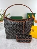 Goyard Bags 180 Goya Bohème Hobo bag epitome of lightness, flexibility, and security, thanks zipper closure.Due to its wide handle, it is very comfortable as shoulder bag.It also features the iconic detachable pouch that can be closed with a snap button. Style number: 98666 Color: Black/Brown Dimensions: 43cm 14cm x 27cm