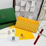 Goyard Bags 90 Goya Matignon Large Wallet is designed as long style with full closure security.It contains 12 card slots, a central zipper pocket, two large storage compartments for cards, banknotes, coins, and other daily documents. Style number: 98188 Color: Yellow Size: 20cm 2.3cm x 11cm