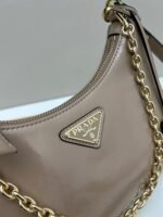 Prada Bags Batch 310 Lacquered Cowhide with Box Re－Edition NaplaK Prada Women's Shoulder or Crossbody Bag Size 22.5X18.5X7CM A bag that recreates the style grids 2005. Prada's design codes are condensed into versatile silhouettes, creating a dialogue between past present styles. Adjustable shoulder strap, parts, detachable key ring, exquisite simple leather item. The triangular logo of enamel metal exudes an iconic and charming design. - Image 4