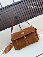 Prada Bags Comes box, batch 250. unique texture.This is of most popular replica series, inspired by Prada's designs from 90s early millennium. It features shoulder strap can be worn crossbody, on one shoulder, hand-held, with an iconic triangular enamel logo detachable small coin pouch.The suede version will give the classic design vintage, soft, warm feel High-quality texture: Suede has soft delicate touch, bringing a vintage and understated luxury vibe that stands out more than smooth leather or nylon. ​ Large size 28x22x11, model 2566