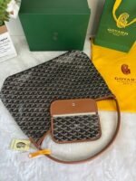 Goyard Bags 180 Goya Bohème Hobo bag epitome of lightness, flexibility, and security, thanks zipper closure.Due to its wide handle, it is very comfortable as shoulder bag.It also features the iconic detachable pouch that can be closed with a snap button. Style number: 98666 Color: Black/Brown Dimensions: 43cm 14cm x 27cm - Image 3