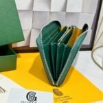 Goyard Bags 90 Goya Matignon Large Wallet is designed as long style with full closure security.It contains 12 card slots, a central zipper pocket, two large storage compartments for cards, banknotes, coins, and other daily documents. Style number: 98188 Color: Green Size: 20cm 2.3cm x 11cm - Image 6