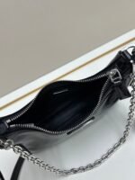 Prada Bags Batch 310 Lacquered Cowhide with Box Re－Edition NaplaK Prada Women's Shoulder or Crossbody Bag Size 22.5X18.5X7CM A bag that recreates the style grids 2005.Prada's design codes are condensed into versatile silhouettes, creating a dialogue between past present styles.Adjustable shoulder strap, parts, detachable key ring, exquisite simple leather item.The triangular logo of enamel metal exudes an iconic and charming design. - Image 7