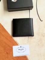 Prada Bags 75PRADA Men's Short Wallet Counter Latest Style, Official Website Synchronization, Genuine Development, Model 2M0513 # Color as shown, blue. The blue leather texture is excellent, with threaded lining. Imported white steel hardware accessories feature a complex color-blocking design, making it more fashionable and unique. Dimensions: Length 11cm, Height 9cm - Image 2