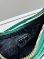 Prada Bags Batch 310 Lacquered Cowhide with Box Re－Edition NaplaK Prada Women's Shoulder or Crossbody Bag Size 22.5X18.5X7CM A bag that recreates the style grids 2005.Prada's design codes are condensed into versatile silhouettes, creating a dialogue between past present styles.Adjustable shoulder strap, parts, detachable key ring, exquisite simple leather item.The triangular logo of enamel metal exudes an iconic and charming design. - Image 8